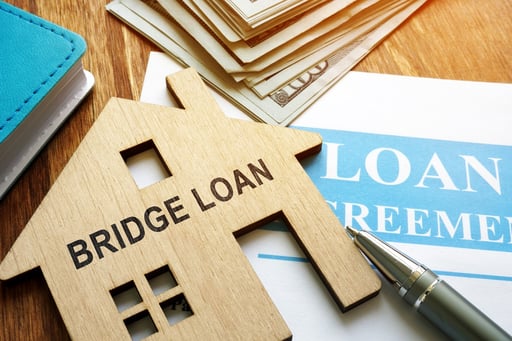 Bridge loan and mortgage agreement with pen and money