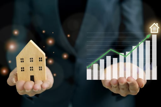 Growth in real estate development concept businesswoman holding a model of home and increasing graph in other hand