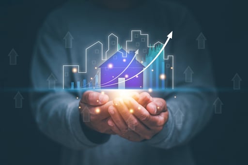 Man holding virtual hologram of city, house, and a growing business graph